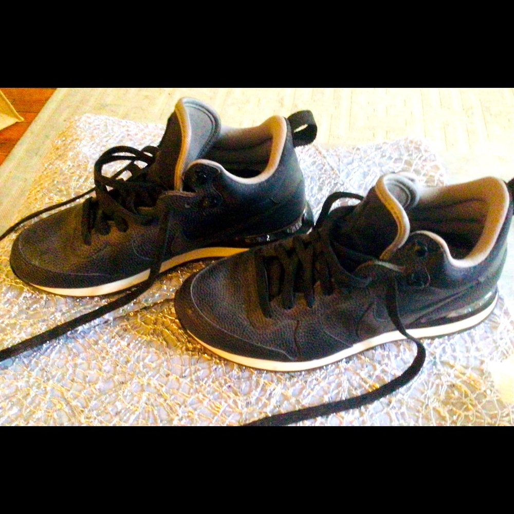 Nike pebbled black leather with silver highlight as seen in photo. Worn once.